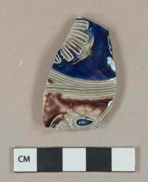 Cobalt and manganese decorated gray salt-glazed stoneware vessel body fragment, molded decoration, gray paste, likely Westerwald type