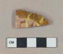 Yellow on tan slip decorated redware vessel body fragment, crossmended