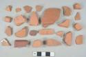 Undecorated unglazed redware vessel body and rim fragments, likely terracotta