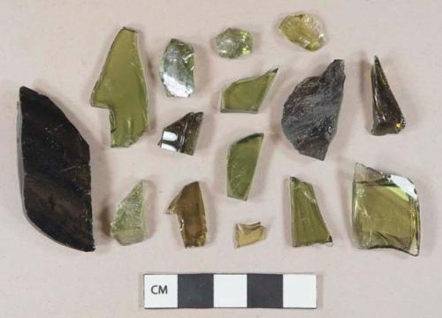 Olive green vessel glass body fragments, likely bottle glass