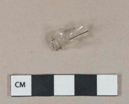 Colorless glass bulb fragment with metal filament, possible cathode