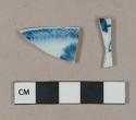 Flow blue on white pearlware vessel body and rim fragments, white paste, 1 possibly handpainted