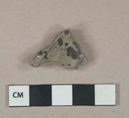 Burned lead glazed redware vessel body fragment