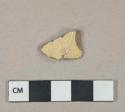 Undecorated yellowware vessel base fragment, light buff paste