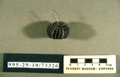 Coiled miniature globular bowl (A) of black horse hair with lid (B)