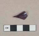 Dark amethyst glass vessel body fragment