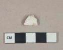 White undecorated kaolin pipe bowl fragment, burned interior