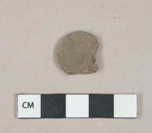 Metal alloy coin fragment, heavily corroded, denomination unknown