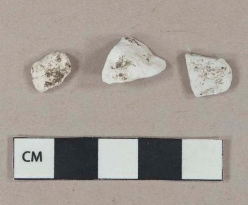 White mortar fragments, heavily weathered