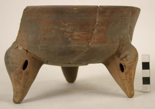 Polychrome pottery tripod bowl, partly restored