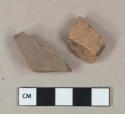 Undecorated unglazed redware vessel body fragments