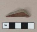 Lustrous brown glazed stoneware fragment, gray paste, visible temper, possible sewer pipe