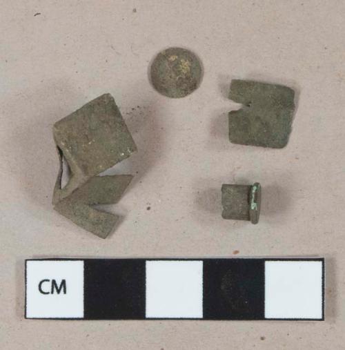 Metal alloy fragments, 1 tack head fragment, 1 .22 short Winchester rimfire cartridge with "U" headstamo and firing pin contact