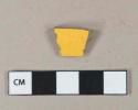 Bright yellow lead glazed earthenware vessel body fragments, light buff paste