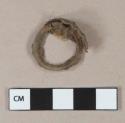 Metal alloy fragment with plastic ring, possibly bottle cap