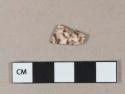 Brown on white sponge decorated earthenware vessel rim fragment, white paste, possiby clouded ware