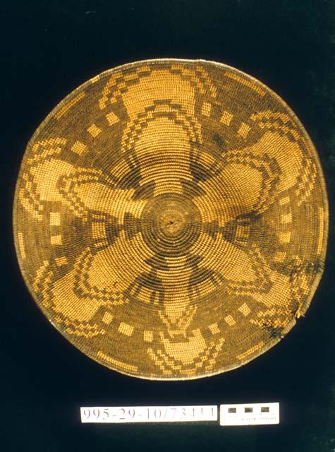 Coiled bowl with human figure motif