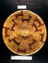 Coiled basketry bowl with flaring sides and animal motif