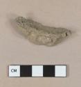 White metal, likely lead, unidentified fragment, oxidized