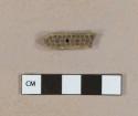 Carved bone toothbrush fragment