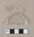 Colorless glass vessel fragments, 1 likely stemware base fragment