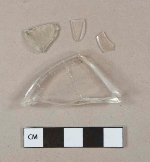 Colorless glass vessel fragments, 1 likely stemware base fragment