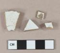 White undecorated ironstone vessel body fragments, white paste, 1 fragment with portion of stamp "JOHN MAD[...]"