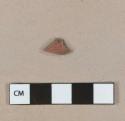 Red lead glazed earthenware vessel fragment, light buff paste