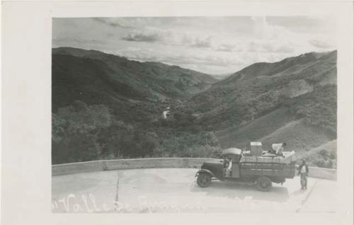 View of the Aragua Valley, men with truck in foreground