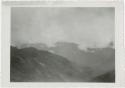 Mountainous valley with low clouds