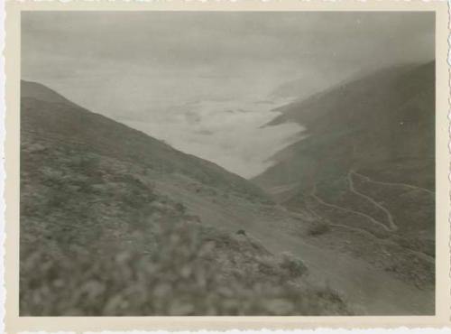 Mountainous valley, with road