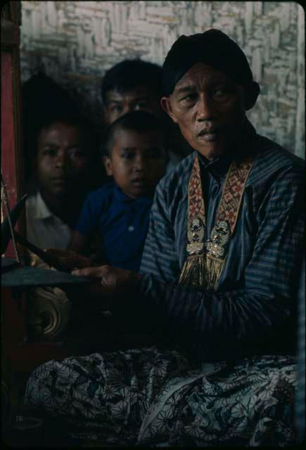 Man playing old gamelan, Grebeg festival