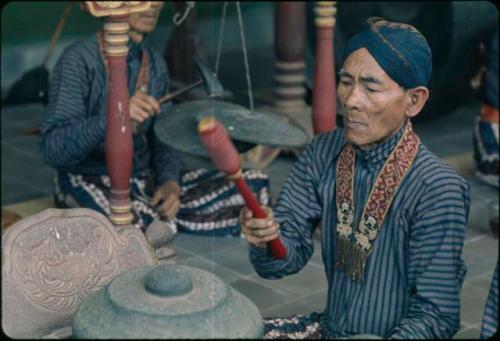 Man playing old gamelan, Grebeg festival