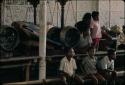 Boys sitting next to old gamelan, Grebeg festival