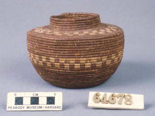 Bottle neck basket, the red is the unpeeled root of the tree yucca