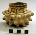 Small studded pottery vessel