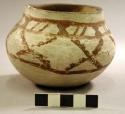 Small pottery vase with brown designs