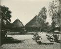 Two huts (print is a cropped image)