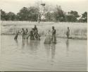 People fishing with baskets (print is a cropped image)