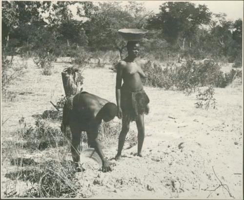 Two women gathering grain (print is a cropped image)