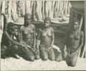 Four women kneeling (print is a cropped image)