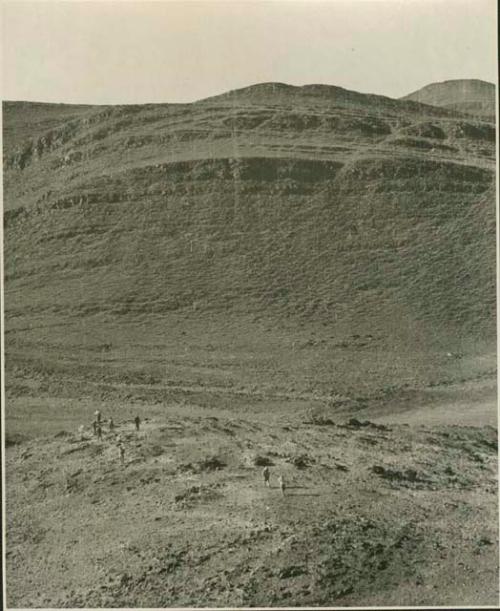 Group of men looking for tin (print is a cropped image)
