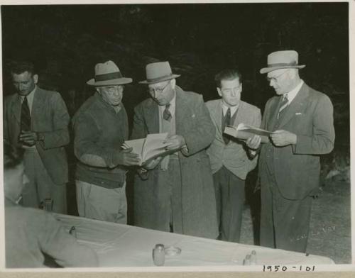 Colonel Hoogenhout standing with Laurence Marshall and other expedition members