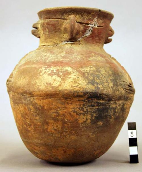 Jar, human face at neck