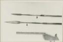 Two spear points and a ruler for measurement; one spear point is ornamented with horizontal lines