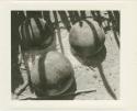Three round-bottomed clay pots (print is a cropped image)