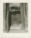 Doorway with a leather curtain and a log threshold (print is a cropped image)