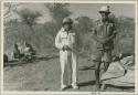 Laurence Marshall and Claude McIntyre standing in the expedition camp