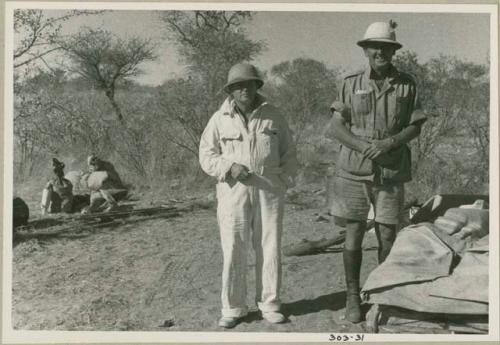 Laurence Marshall and Claude McIntyre standing in the expedition camp