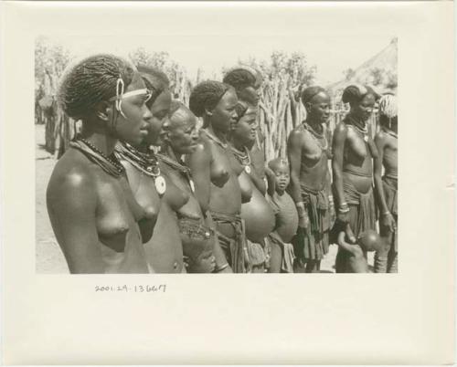 Women and children standing in a semi-circle, close-up (print is a cropped image)